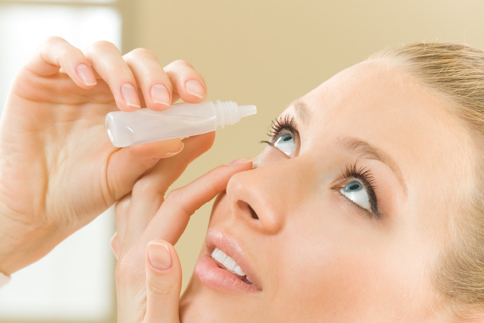 a lady dropping eye cleaner - EDENOR brand banner