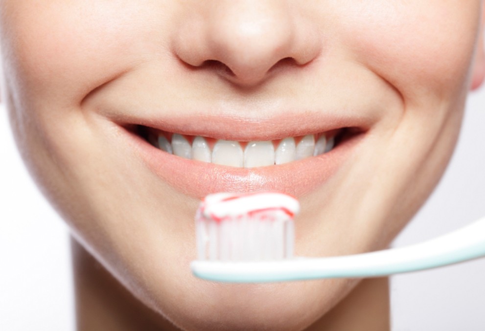 PALMERA oleochemical brand banner - lady using toothpaste