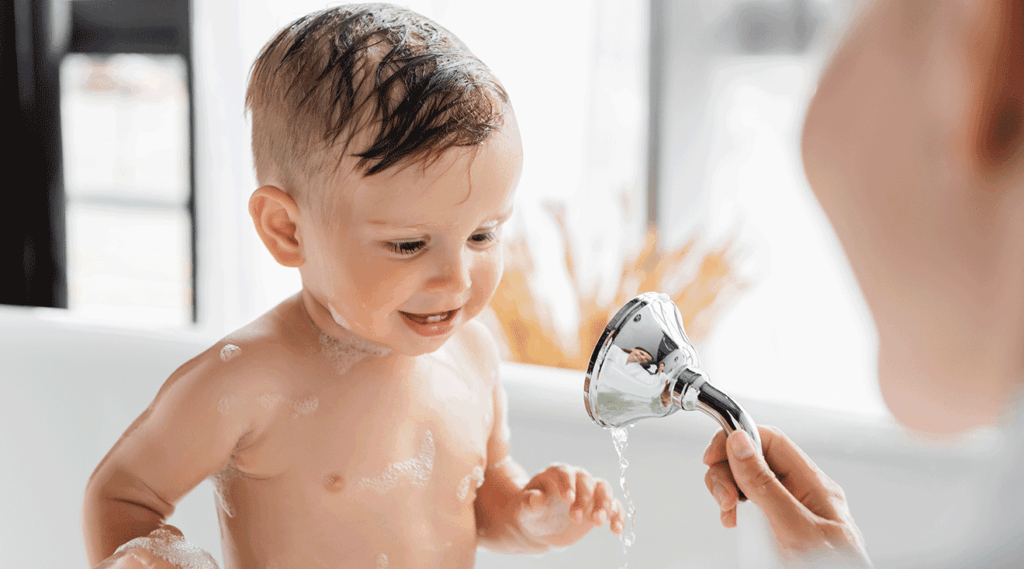 a baby in a bath - PALMOSALT brand banner