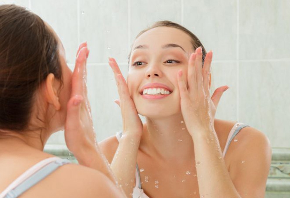TENSOPOL brand banner - Lady in the bathroom taking care of her skin